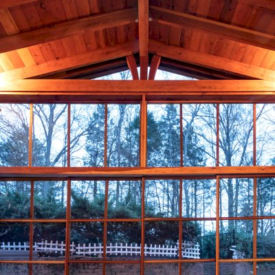 Forever Porch Pavilion (Options: 20' L x 20'-9" W, California Redwood, 2-Post Anchor Kit for High-Wind, No Electrical Wiring Trim, with 2 Fascia Boards for Gutters, 12 ft Posts Height, No Post Decorative Trims, 1 Ceiling Fan Base, No Curtain Rods, with Privacy Panels, Screened Sliding Doors and Fixed Screen Panels, Transparent Premium Sealant). Photo Courtesy of J. Pegg of Cordova, TN.